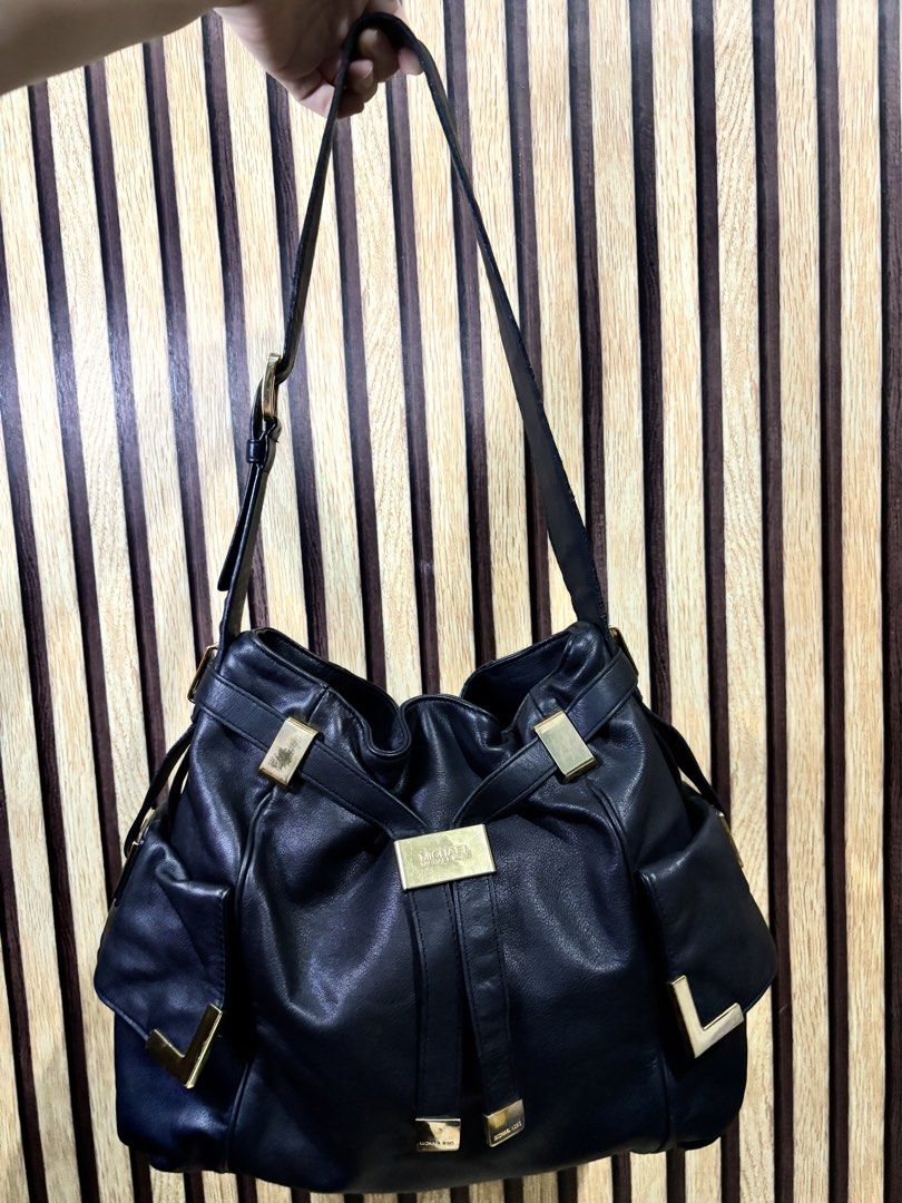 Michael Kors Black Leather Shoulder Bag Gold Hardware (Category: Luxury Bags & Wallets) located in Caloocan City. Submitted by berndale_closet (Listing ID 1455192915, Image 1). Description: - Authentic Michael Kors black leather shoulder bag - Elegant gold hardware details - Spacious main zip compartment - Convenient exterior pockets - Soft and supple leather for a luxurious feel - Adjustable straps for comfortable wear - Ideal everyday bag for a