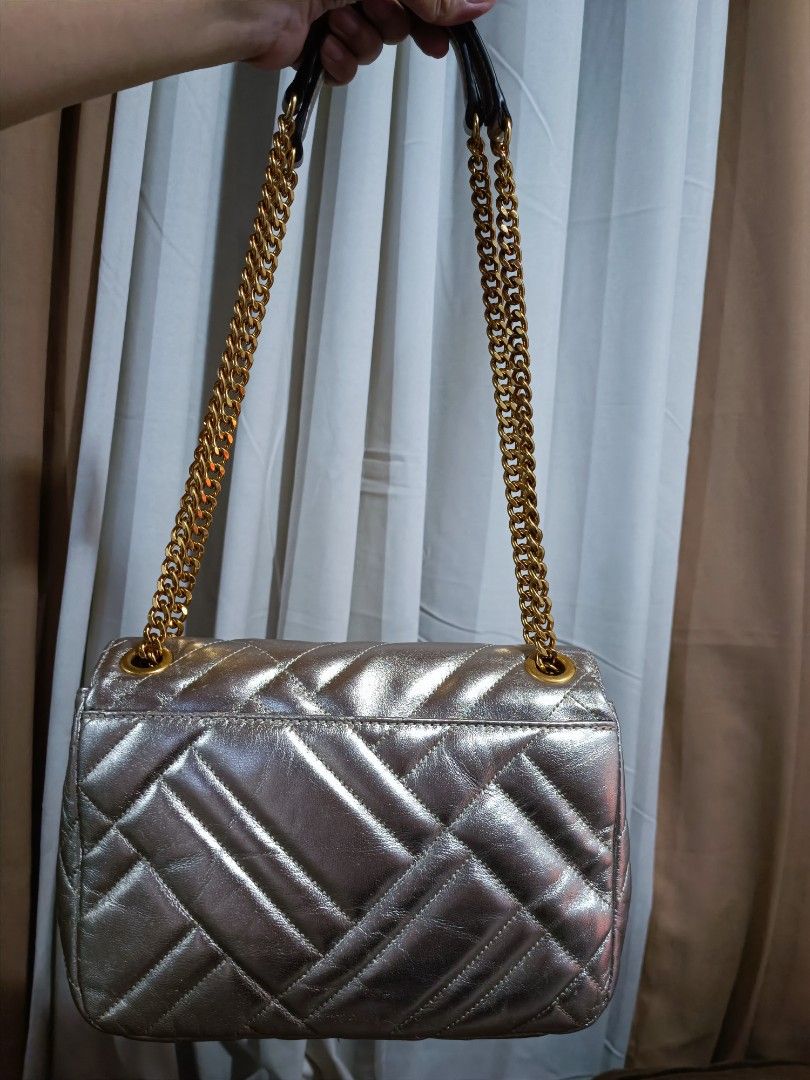 Michael Kors Vivianne Medium Shoulder Flap Bag (Category: Luxury Bags & Wallets) located in Pasig City. Submitted by charmillee (Listing ID 1455311623, Image 2). Description: •Unused item (still with tag) but stored •Japan-bought •see photos for issues (light spots on metallic leather due to storage) •clean inside •strap and hardware in like new condition •perfect as an event bag.