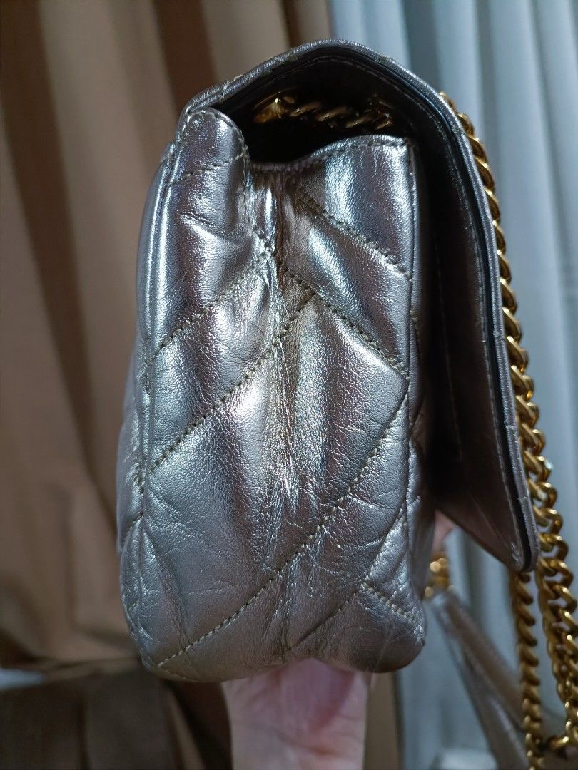 Michael Kors Vivianne Medium Shoulder Flap Bag (Category: Luxury Bags & Wallets) located in Pasig City. Submitted by charmillee (Listing ID 1455311623, Image 3). Description: •Unused item (still with tag) but stored •Japan-bought •see photos for issues (light spots on metallic leather due to storage) •clean inside •strap and hardware in like new condition •perfect as an event bag.