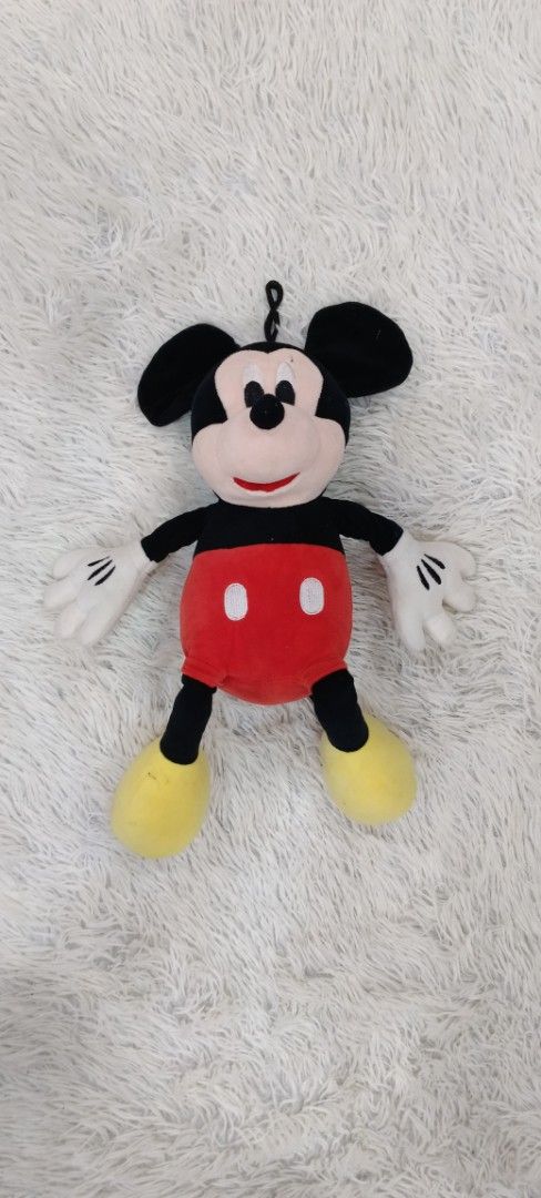 Mickey Mouse Plush Toy (Category: Plushies & Soft Toys) located in Manila. Submitted by tylord08es95589 (Listing ID 1455318089, Image 2). Description: - Classic Mickey Mouse plush toy - Soft and cuddly material - Features a hanging loop at the top - Ideal for Disney enthusiasts and collectors - Looking for a new loving home.