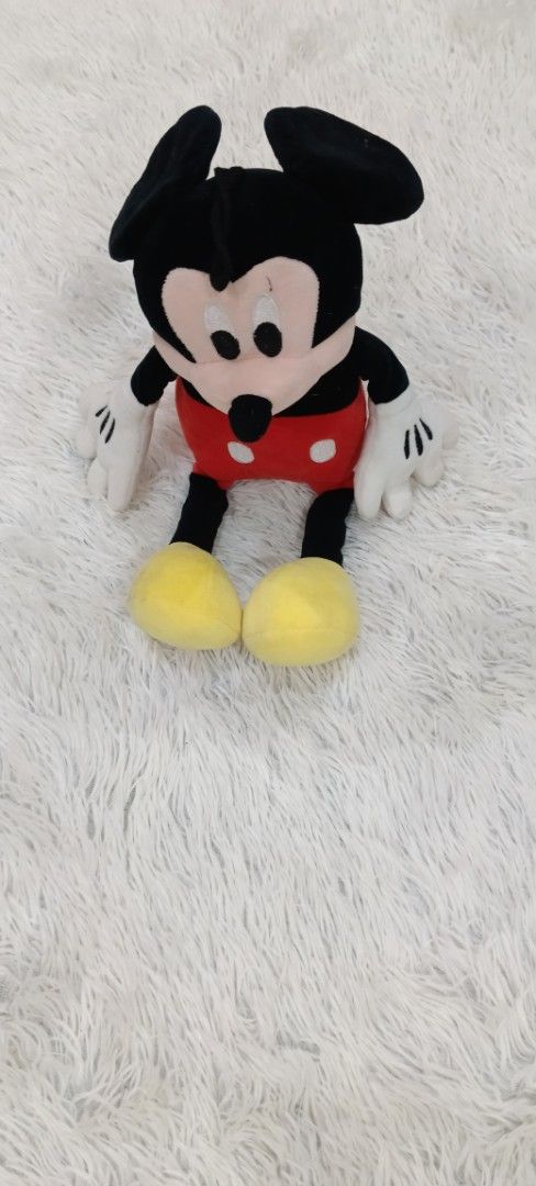Mickey Mouse Plush Toy (Category: Plushies & Soft Toys) located in Manila. Submitted by tylord08es95589 (Listing ID 1455318089, Image 1). Description: - Classic Mickey Mouse plush toy - Soft and cuddly material - Features a hanging loop at the top - Ideal for Disney enthusiasts and collectors - Looking for a new loving home.