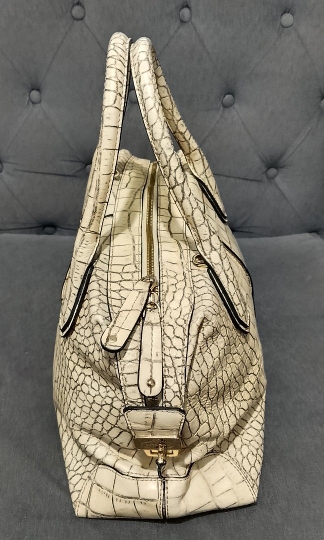 Morgan de Toi crocodile-embossed leather handbag. (Category: Shoulder Bags) located in Cavite. Submitted by authentickids_wear (Listing ID 1455291603, Image 2). Description: The item shown is a Morgan de Toi crocodile-embossed leather handbag. This structured boston/satchel bag style features a cream or off-white exterior finished with a pronounced faux-crocodile texture, distinct vertical stitched center panels, and robust twin top handles. Key 