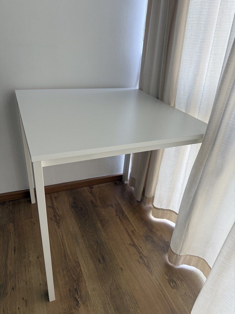 Multipurpose table (Category: Tables & Sets) located in Singapore. Submitted by pakhi6 (Listing ID 1455218639, Image 3). Description: Selling a white square study/computer table in excellent condition. * Dimensions: 74 × 74 × 74 cm * Sturdy wooden tabletop with white legs * Compact and perfect for studying, working, or as a small dining table * Clean and well-maintained * No dismantling required; can be used immediately Self-collection preferred 