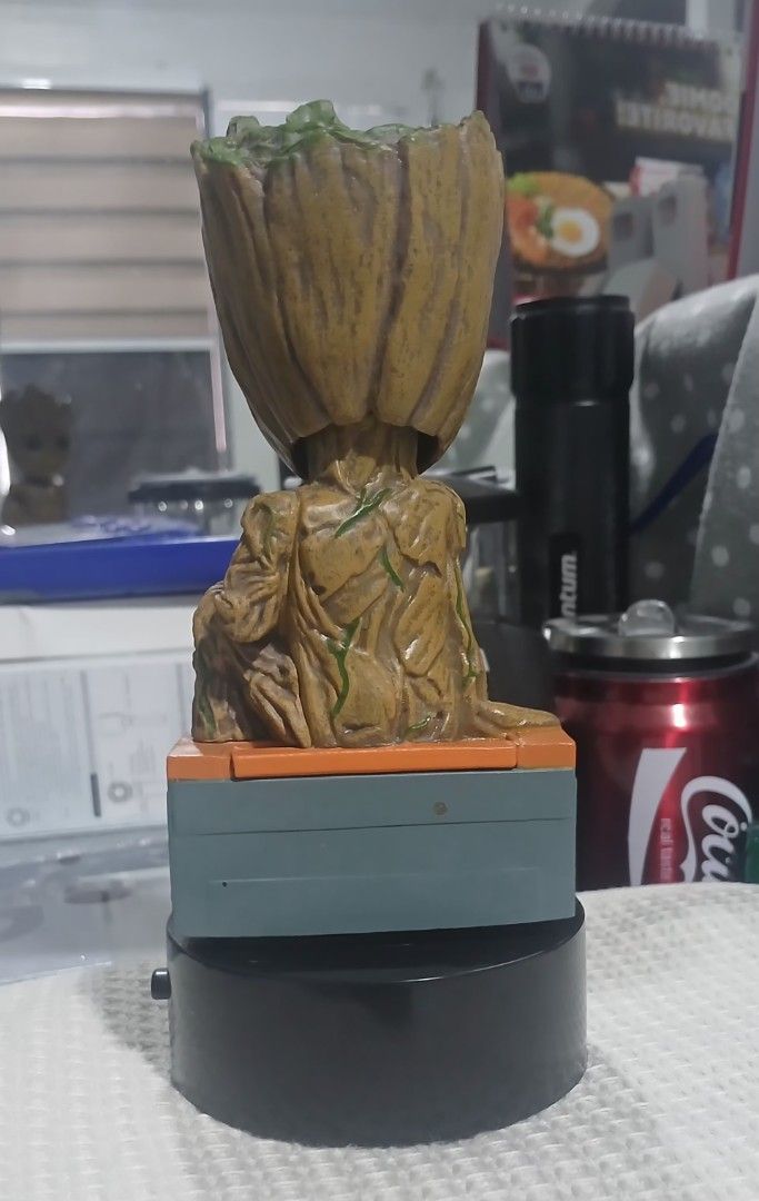 Neca Marvel Groot Body Knocker Solar Power Bobble Head (Category: Figurines & Statues) located in Bocaue. Submitted by rarestar.07ba01 (Listing ID 1455165661, Image 2). Description: - Awesome Groot bobble head from Guardians of the Galaxy Vol. 2. - Sits on a cool boombox base. - Solar-powered body knocker - moves. - Made by Neca. - Perfect collectible for any Marvel fan..