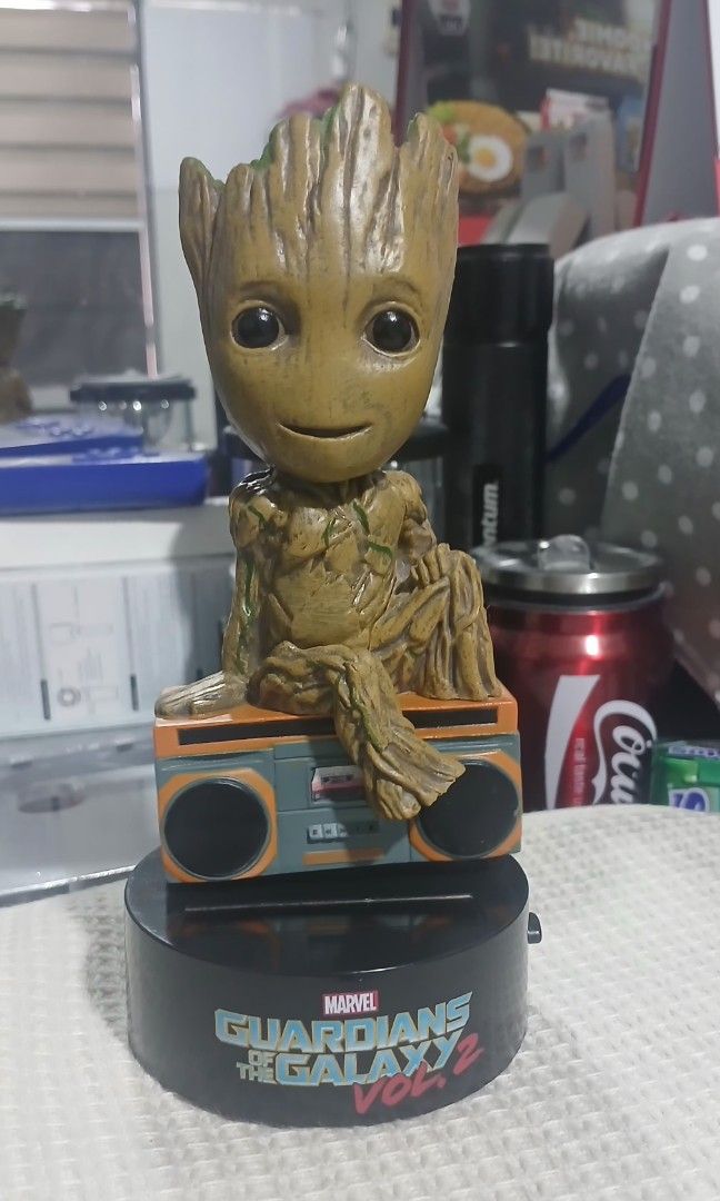 Neca Marvel Groot Body Knocker Solar Power Bobble Head (Category: Figurines & Statues) located in Bocaue. Submitted by rarestar.07ba01 (Listing ID 1455165661, Image 1). Description: - Awesome Groot bobble head from Guardians of the Galaxy Vol. 2. - Sits on a cool boombox base. - Solar-powered body knocker - moves. - Made by Neca. - Perfect collectible for any Marvel fan..