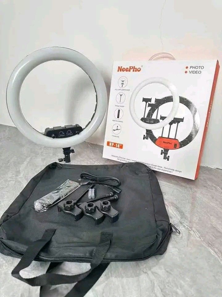 NeePho NP-14" Ring Light Blogger Set with Accessories (Category: Rings) located in Manila. Submitted by marvieobordo (Listing ID 1455193296, Image 2). Description: - NeePho NP-14 inch Ring Light - Perfect for photos and videos - Includes: Phone holder, remote control, power line - Features: 360° rotation, eye protection design - Input Voltage: AC100-240V - Color Temperature: 3000-6500K - Origin: Made in China - Bonus: Comes with a carrying bag.