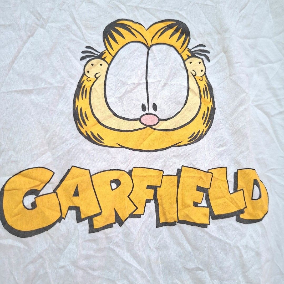 Nickelodeon Garfield White T-shirt Size M (Category: Tshirts & Polo Shirts ) located in Batangas. Submitted by sell_ph (Listing ID 1455172220, Image 2). Description: - White t-shirt with a fun Garfield graphic print - Features the official Nickelodeon Garfield logo on the tag - Made from comfortable and breathable 100% cotton - Size Medium (M) - Perfect for any Garfield enthusiast!.