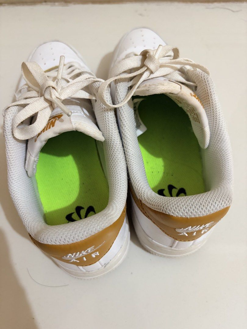 Nike Air Force 1 '07 Gold Sneakers (Category: Sneakers) located in Paranaque City. Submitted by aacc0920 (Listing ID 1455205190, Image 2). Description: - Classic white Nike Air Force 1 '07 - Features gold accents on Nike Air logo and lace tag - Great for everyday wear - Selling because they no longer fit.