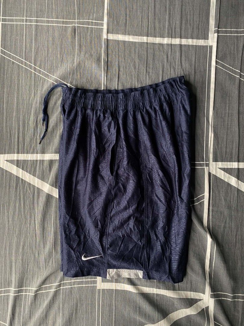 Nike Navy Blue Mesh Athletic Shorts Size M (Category: Shorts) located in Manila. Submitted by raymondrob54698 (Listing ID 1455172228, Image 1). Description: - Navy blue Nike athletic shorts - Breathable mesh material - Elastic waistband with drawstring - Small Nike swoosh logo on left leg - Ideal for sports and casual wear.