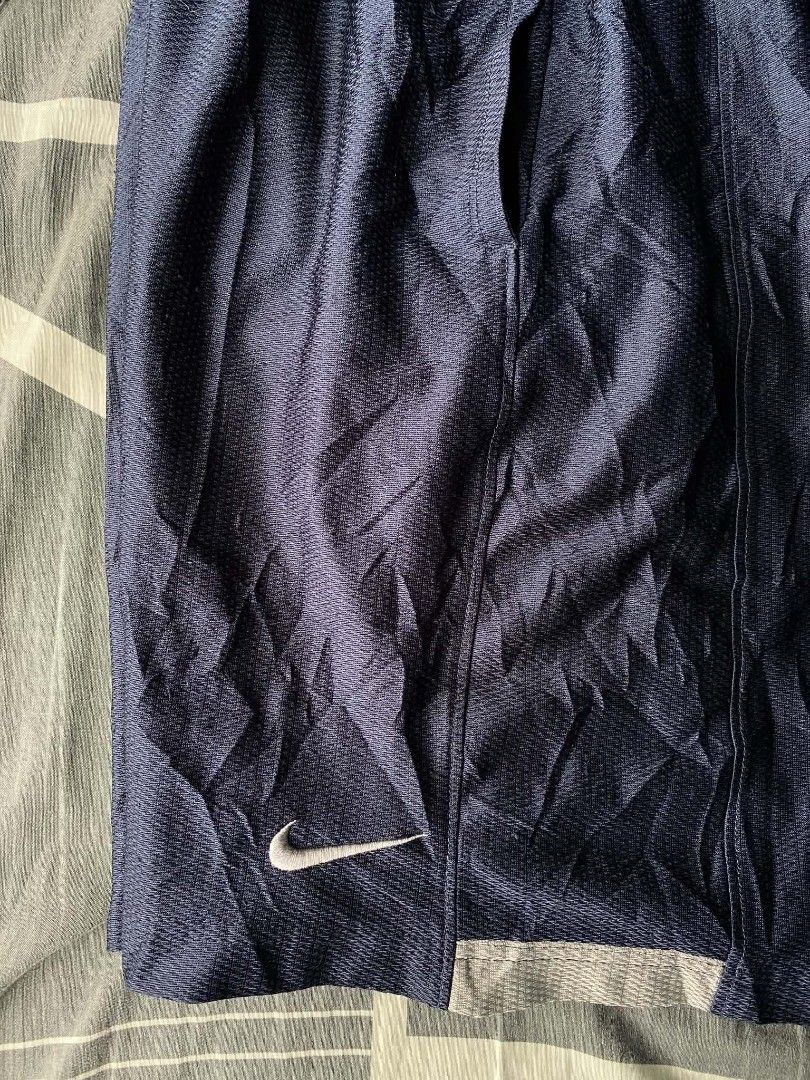 Nike Navy Blue Mesh Athletic Shorts Size M (Category: Shorts) located in Manila. Submitted by raymondrob54698 (Listing ID 1455172228, Image 2). Description: - Navy blue Nike athletic shorts - Breathable mesh material - Elastic waistband with drawstring - Small Nike swoosh logo on left leg - Ideal for sports and casual wear.