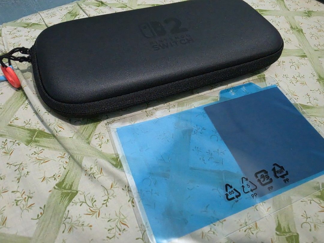 Nintendo Switch 2 Carrying Case + Screen Protector Set (Category: Cases & Covers) located in Makati City. Submitted by goodjojorabbit (Listing ID 1455310629, Image 2). Description: 🎮 FOR SALE: Nintendo Switch 2 Carrying Case + Screen Protector Set 🎮 • Price: ₱1,100 • Condition: Unused / Open Box (Box was opened to inspect, but never actually used). Excellent condition. • Includes: Original Nintendo Switch 2 protective carrying case, screen prot