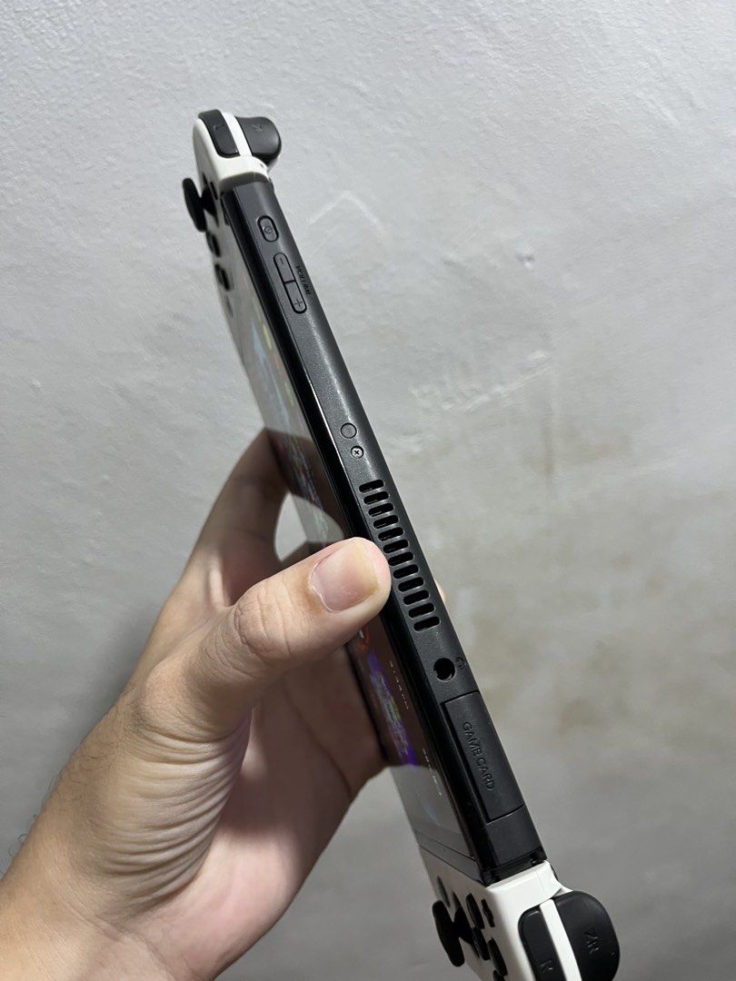 Nintendo switch oled 256gb (JAILBREAK UNIT) (Category: Nintendo) located in Manila. Submitted by apple_siri (Listing ID 1455211691, Image 3). Description: Nintendo switch oled 256gb jailbreak unit naka dual boot po sya complete with box and accessories madaming games naka install po Makinis yung unit halos naka tambak lang palagi check nyo sa pics kung gaano ka kinis rfs mula nung binili ilang beses lang ginamit as is na tambak na lang po yung un