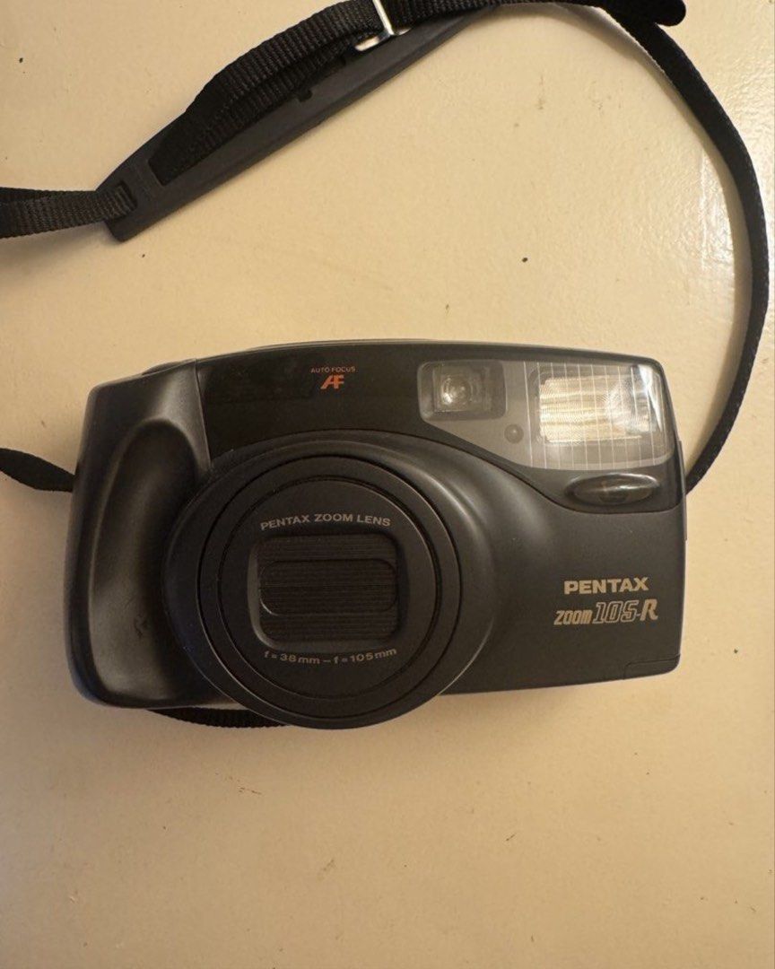 Pentax Zoom 105-R Film Camera (Category: Cameras) located in Manila. Submitted by dprnise (Listing ID 1455301039, Image 1). Description: ✅ 35 mm point-and-shoot film camera ✅ with 2 new batteries (bought dec 2025) ✅ condition: 8/10 with signs of use ✅ originally bought for ₱4,000 ✅ DM for sample shots ✅ inclusions: battery and leather case ✅ perfect for beginners RFS: not using it anymore Price is negotiable. Shipping must be shouldered by the bu
