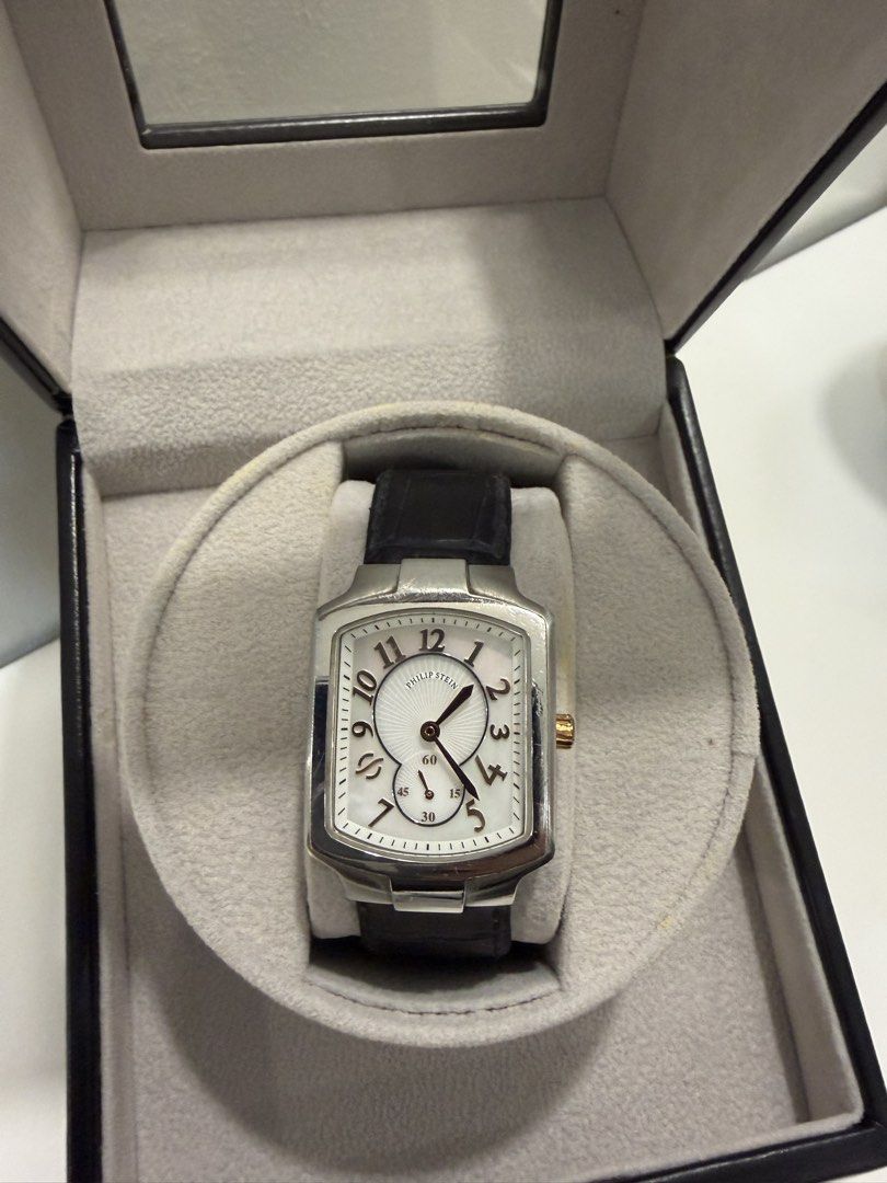 Philip Stein Two-Tone Watch with Leather Strap (Category: Women's Watches) located in Manila. Submitted by DocDenP (Listing ID 1455264536, Image 1). Description: - Authentic Philip Stein watch - Elegant silver dial with Roman numeral hour markers/ Mother of Pearl - Features a convenient sub-dial - Comes with original Philip Stein box - Includes an extra brown leather strap for versatility - Purchase receipt dated February 12, 2022, is included - 