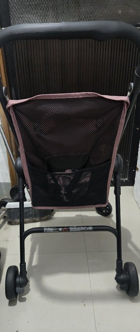 Pink Lightweight Baby Stroller with Storage Basket (Category: Strollers) located in Manila. Submitted by opssyyyy (Listing ID 1455314074, Image 3). Description: - Lightweight pink stroller - Secure 5-point harness - Breathable mesh back - Convenient storage basket - Easy folding for transport - Minor wear on handle grip (see last photo) - Fully functional and ready for use.