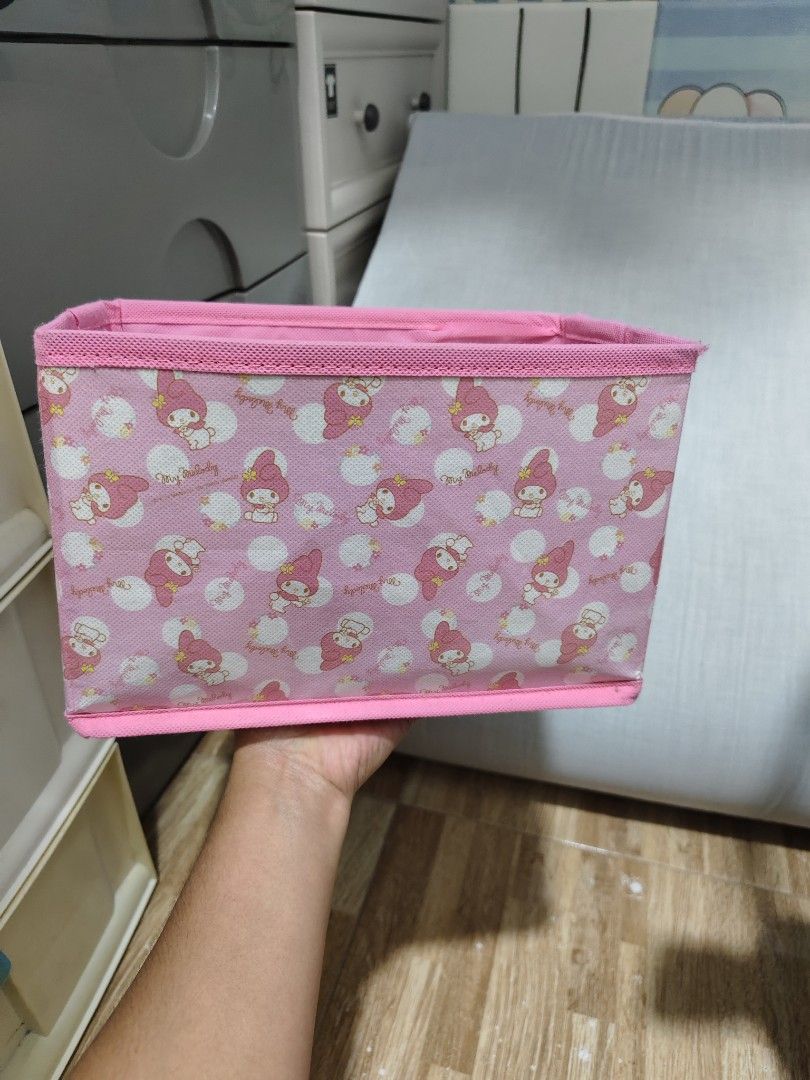 Pink My Melody Storage Box Organizer (Category: Storage Boxes & Baskets) located in Makati City. Submitted by abegailbrezuela (Listing ID 1455244312, Image 1). Description: - Adorable pink storage box featuring My Melody. - Ideal for organizing small items like stationery, accessories, or knick-knacks. - Folds flat for convenient storage when not in use. - Perfect for tidying up desks, shelves, and drawers. - Adds a cute and functional touch to y