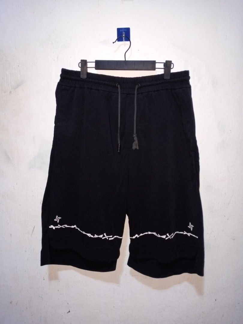 PLEIK PHOLPPE Black Shorts with Barbed Wire Design (Category: Shorts) located in Binan City. Submitted by kaithrifting (Listing ID 1455215842, Image 1). Description: - Brand: PLEIK PHOLPPE - Color: Black - Size: 34 - Design: Barbed wire and star detail along the hem - Features: Adjustable drawstring waist - Occasion: Casual wear.