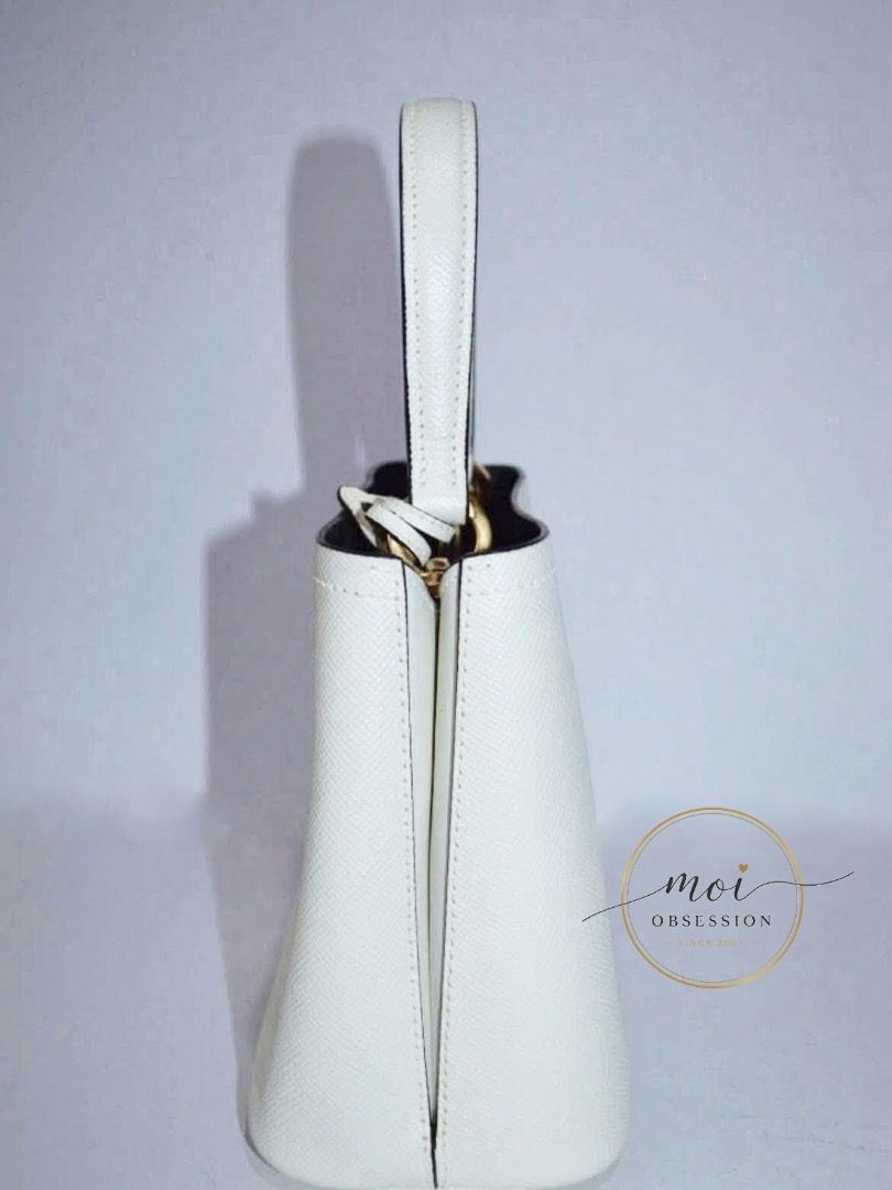PRADA PANIER WHITE SAFFIANO (Category: Luxury Bags & Wallets) located in Cagayan de Oro. Submitted by moiobsession (Listing ID 1455255347, Image 2). Description: PRADA PANIER BAG 🤍 Elegant • Structured • Timeless A beautiful Prada Panier in classic white Saffiano leather — structured, sophisticated, and effortlessly elegant. ✨ ✔ Authentic Prada ✔ Prada Panier design ✔ White Saffiano leather ✔ Gold-tone hardware ✔ Top handles + detachable shoulde