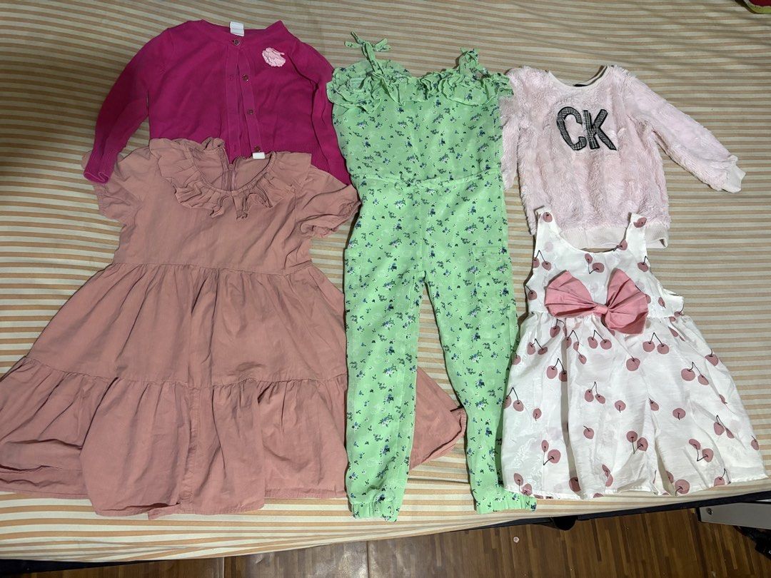 Preloved bundle clothes 2-3 yo girl (Category: Babies & Kids Fashion) located in Cavite. Submitted by declutterbymeee (Listing ID 1455199108, Image 3). Description: Take all 799php - Bundle of girls' clothes - Includes: dresses, green floral jumpsuit, pink cardigan, fluffy pink top, cream unicorn sweatshirt, grey heart hoodie, red jacket, denim overall dress Mostly branded po For 2-3 yo baby girl Loc: san pedro laguna Shipping thru j&t.