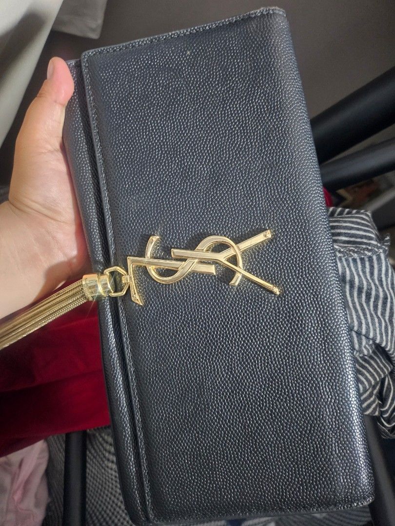 Preloved YSL clutch (Category: Luxury Bags & Wallets) located in Tacloban City. Submitted by re_store23 (Listing ID 1455205278, Image 1). Description: •Please manage your Expectations this is prelove and not brandnew! •Uk@y source po ito but selected kaya maayos pa po. •Clutch bag lang walang sling or lagayan ng sling. •Medyo mahaba po •Coded •What you see is what you get..