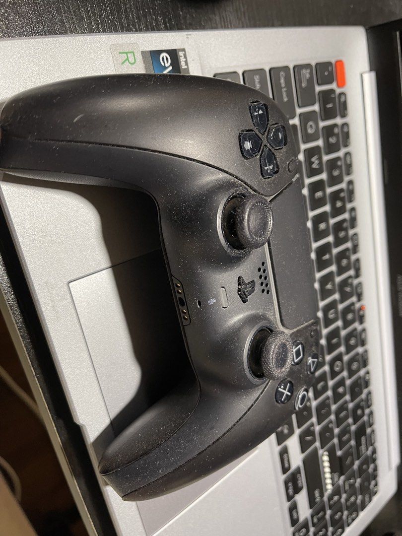 PS5 controller (Category: Controllers) located in Singapore. Submitted by Labradorer (Listing ID 1455286773, Image 1). Description: - PS5 controller in black - Good working condition - Compatible with PlayStation consoles - Meetup at Lakeside MRT (201 Boon Lay Way, 649845) - Tracked shipping available (3-5 days delivery, $3 fee).