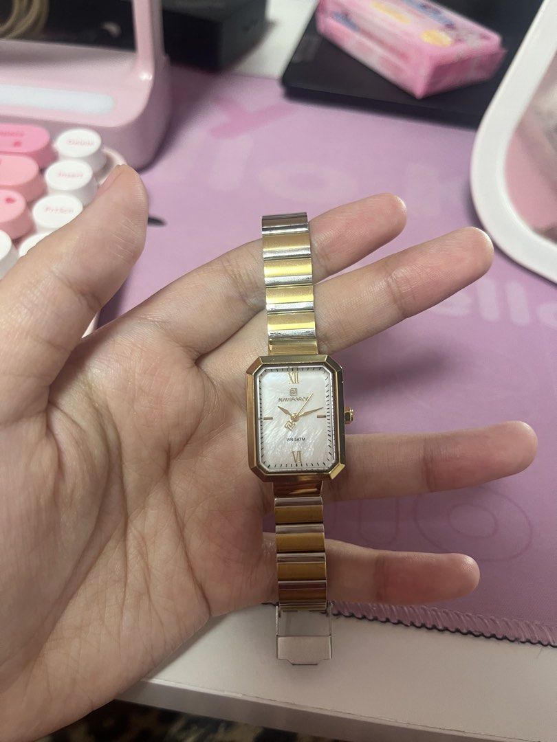 Watch Two-Tone Stainless Steel (Category: Luxury Watches) located in Muntinlupa City. Submitted by araberroya (Listing ID 1455314457, Image 2). Description: - Authentic Rado quartz watch - Two-tone stainless steel band - Rectangular face with a beautiful mother-of-pearl dial - Classic Roman numeral hour markers - Works perfectly and keeps great time - Ideal for both daily wear and special events - Timeless and elegant design.