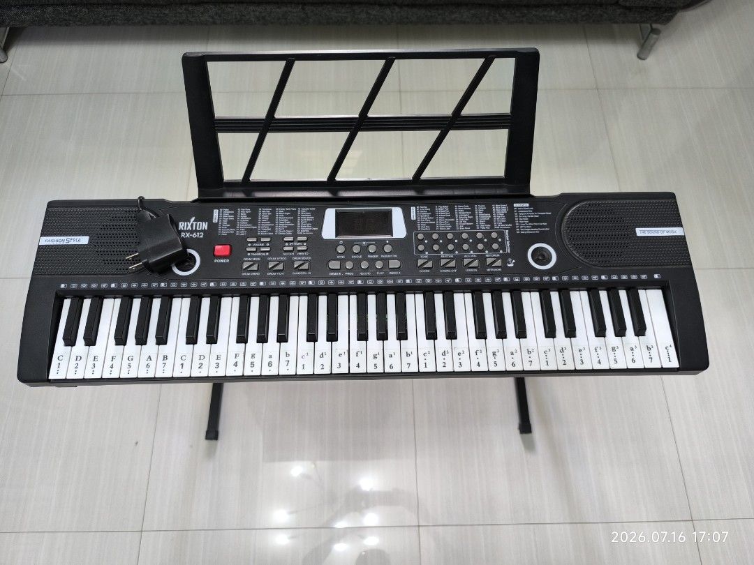 Rixton RX-612 61 Keys Electronic Keyboard with Microphone & Stand (Category: Musical Instruments) located in Marikina City. Submitted by ronald.santos1 (Listing ID 1455238470, Image 3). Description: - Rixton RX-612 Keyboard - 61 Keys - 100 Tones - 61 Rhythms - Includes Microphone - Includes Music Stand - Original Adapter Included - Audio Cable Included - Comes with PS002 Piano Stand - Ideal for learning and playing Location: Marikina.
