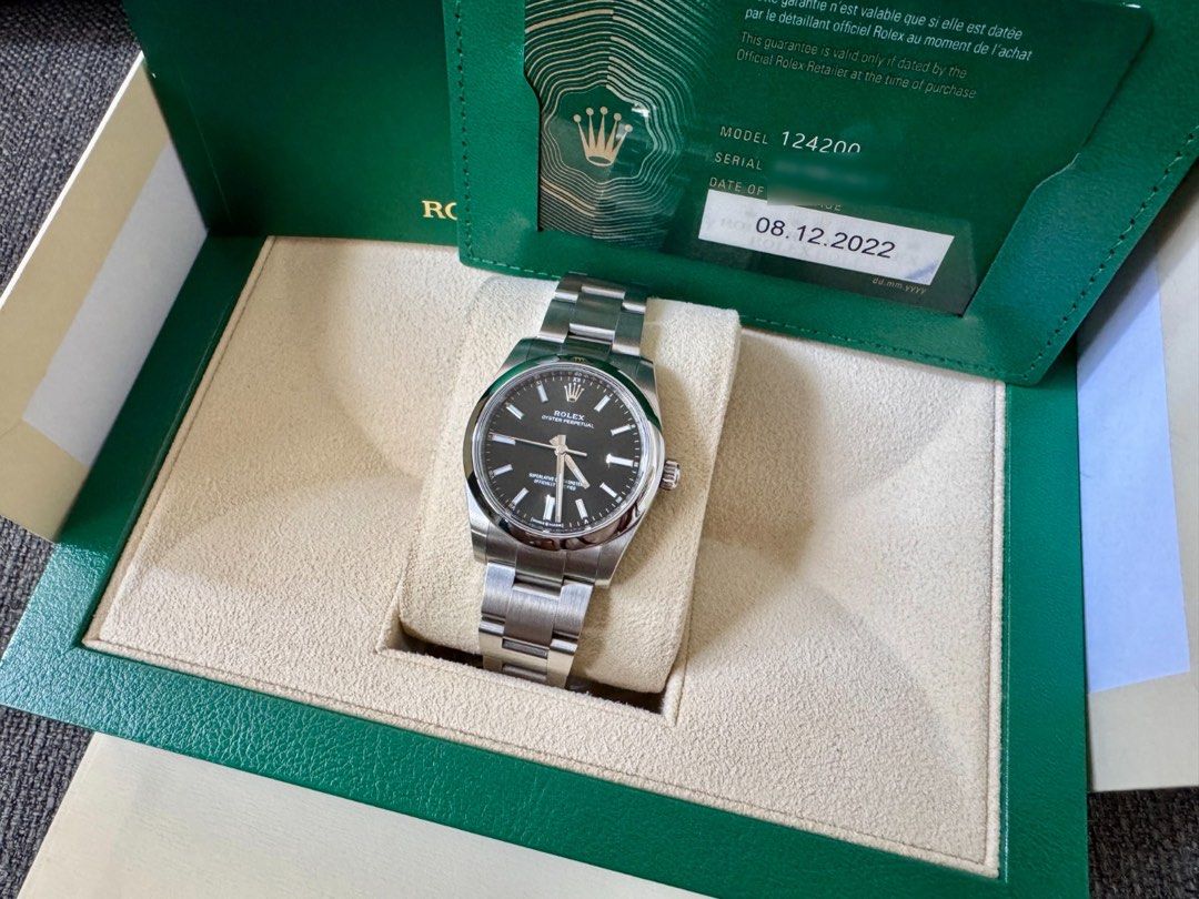 Rolex Oyster Perpetual 124200 Black Dial (Category: Watches) located in Singapore. Submitted by stammer (Listing ID 1455273459, Image 3). Description: - Rolex Oyster Perpetual 124200 - Stunning Black Dial - Purchased on 08.12.2022 - Comes with Original Box - Includes Original Warranty Card - Versatile for daily wear or special events - Serious buyers welcome.
