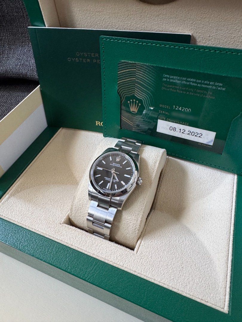 Rolex Oyster Perpetual 124200 Black Dial (Category: Watches) located in Singapore. Submitted by stammer (Listing ID 1455273459, Image 1). Description: - Rolex Oyster Perpetual 124200 - Stunning Black Dial - Purchased on 08.12.2022 - Comes with Original Box - Includes Original Warranty Card - Versatile for daily wear or special events - Serious buyers welcome.