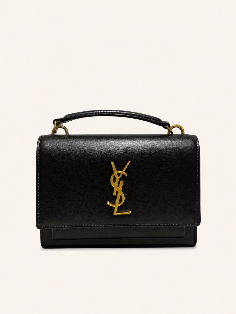 Saint Laurent YSL Sunset Bag w/ entrupy (Category: Luxury Bags & Wallets) located in San Fernando. Submitted by mijuonlinestore (Listing ID 1455225184, Image 1). Description: Condition: Rank A - Classic black leather handbag by Saint Laurent - Features iconic gold-tone YSL logo hardware - Top handle and secure flap closure - Versatile design suitable for day or evening wear Complete Inclusions: Dust bag, paper bag, box, and entrupy certificate Pr