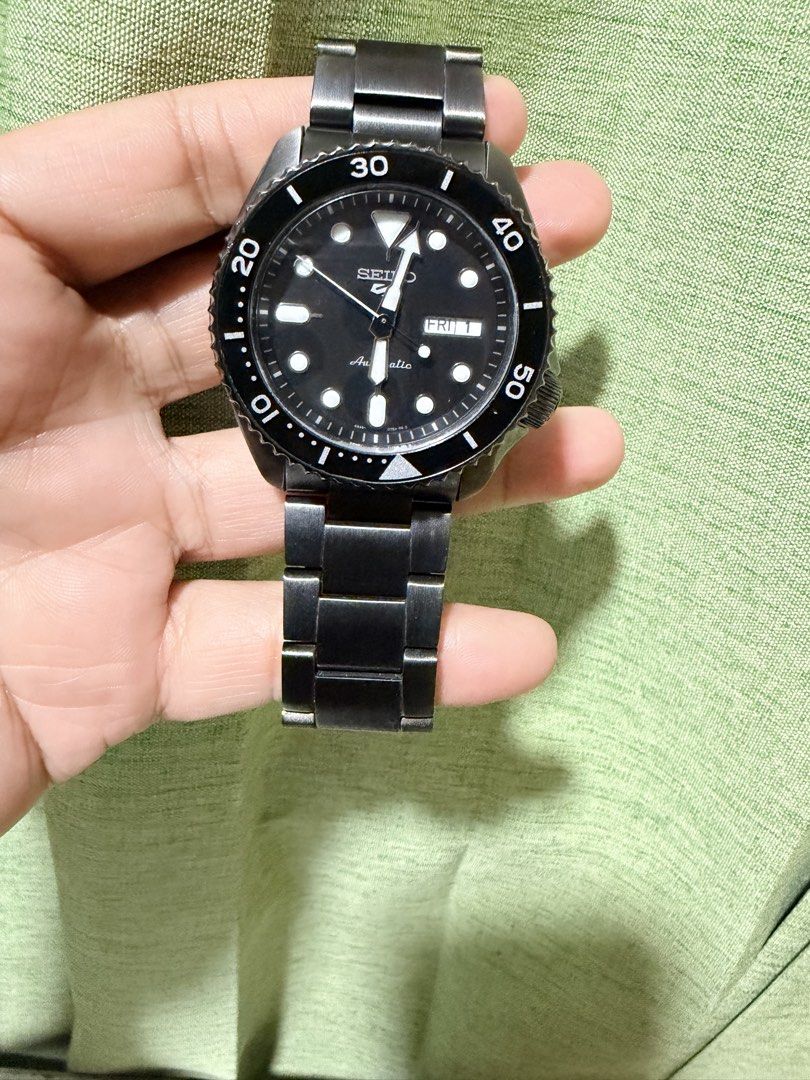 Seiko 5 Automatic Black Stainless Steel Watch (Category: Men's Watches) located in Makati City. Submitted by tybexpress (Listing ID 1455265404, Image 1). Description: - Seiko 5 Automatic Watch - Stainless steel bracelet - Day and date display - Rotating bezel - Ideal for everyday wear - Selling because it's not worn often.