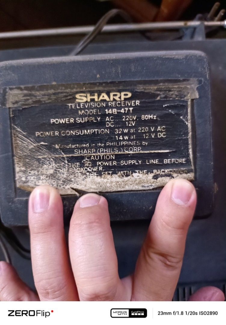 Sharp 14-inch CRT Television (Category: TV) located in Claveria. Submitted by raiserx (Listing ID 1451336477, Image 2). Description: - Vintage 14-inch Sharp CRT Television - Features manual controls for contrast, brightness, and V-hold - Distinctive red power button - Original tuning dial still intact - Defective or not working, for display only.