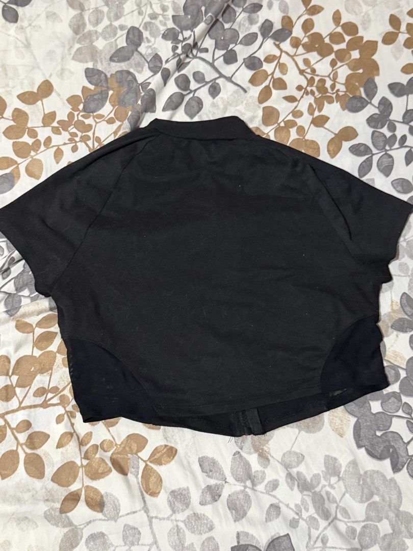 SHEIN Black Cropped Zip-Up Top with Mesh Panels (Category: Others Tops) located in Taytay. Submitted by cloudy_20 (Listing ID 1455273416, Image 2). Description: - SHEIN black cropped zip-up top - Short sleeves - Mesh paneling on sides and hem - White graphic text on front - Zipper closure - Fits M-L.