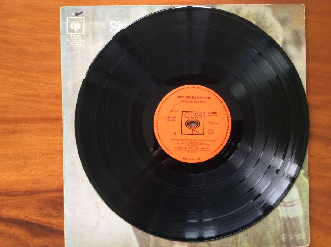 Simon & Garfunkel Bridge Over Troubled Water Vinyl Record (Category: Vinyls) located in Silang. Submitted by lorenzo0000 (Listing ID 1455174390, Image 3). Description: - Classic Simon & Garfunkel vinyl record - Album: 'Bridge Over Troubled Water' - Features all iconic songs - Includes album cover and vinyl record - Great addition to any music collection.