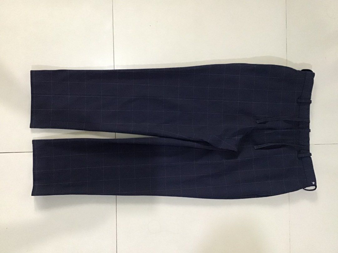 Smart ankle 2 way stretch Windowpane (Category: Trousers) located in Manila. Submitted by sandobag (Listing ID 1455209516, Image 1). Description: W 32-34 L 37 Excellent condition Color rate;10/10 - Navy blue pants with a classic checkered pattern. - Features a comfortable drawstring waist for a customizable fit. - Crafted from a durable polyester blend. - Versatile for both casual outings and smart-casual occasions. - Offers a blend of comfort an