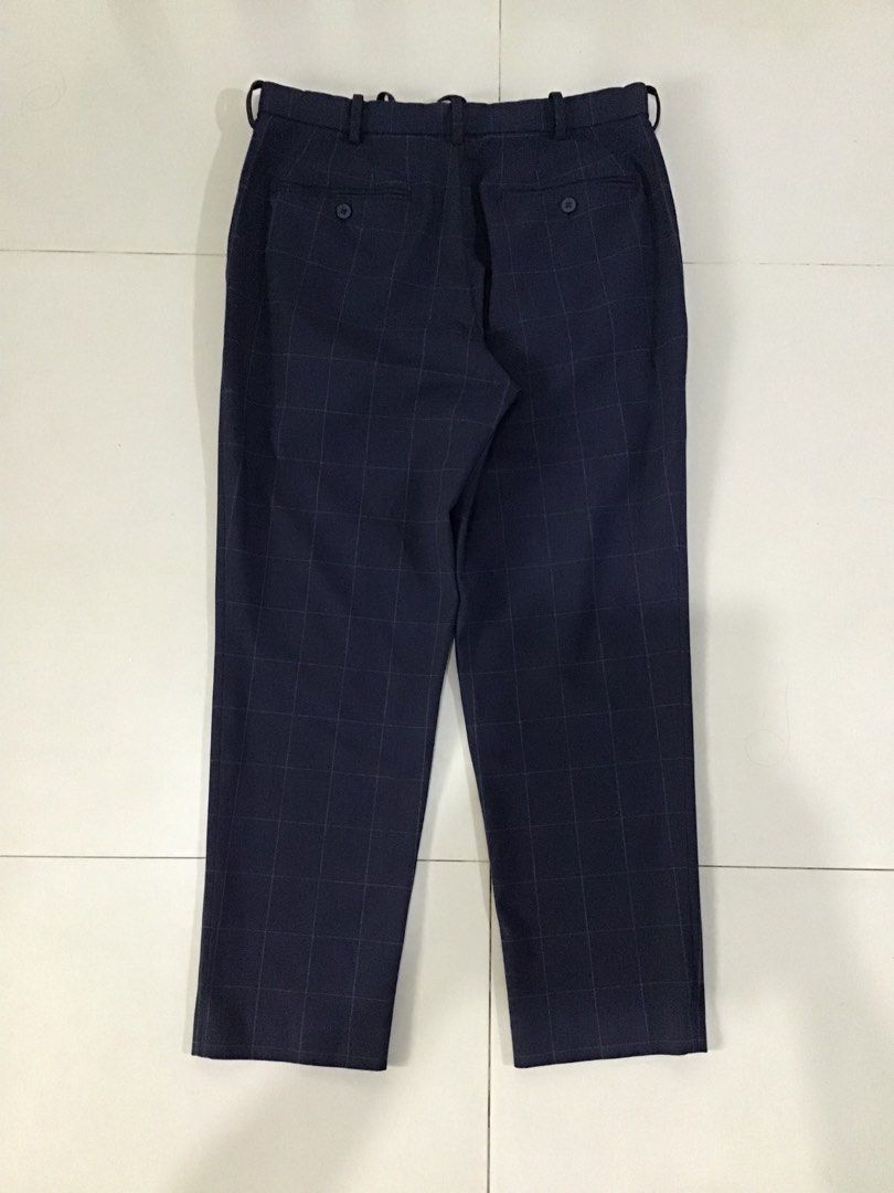 Smart ankle 2 way stretch Windowpane (Category: Trousers) located in Manila. Submitted by sandobag (Listing ID 1455209516, Image 2). Description: W 32-34 L 37 Excellent condition Color rate;10/10 - Navy blue pants with a classic checkered pattern. - Features a comfortable drawstring waist for a customizable fit. - Crafted from a durable polyester blend. - Versatile for both casual outings and smart-casual occasions. - Offers a blend of comfort an