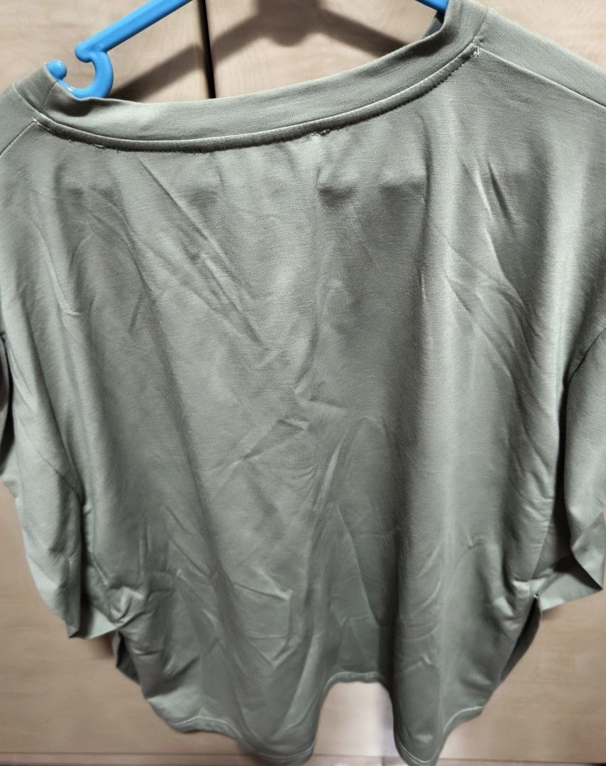 Solid Top (Category: Other Tops) located in Singapore. Submitted by argmc (Listing ID 1455269013, Image 2). Description: - Brand: Love Bonito - Type: Solid Top - Size: XXL (UK 16 / US 12 / EU 44) - Colour: Olive Green - Condition: Excellent - Features: Comfortable, relaxed fit, soft material - Meetup available at Clementi MRT.
