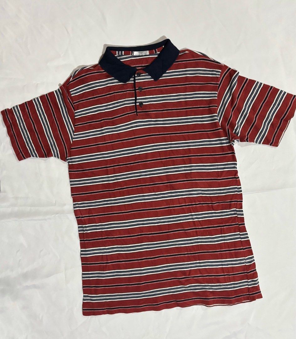 St Michael Marks & Spencer Striped Polo Shirt - Large (Category: Tshirts & Polo Shirts ) located in Iloilo. Submitted by iconicangie (Listing ID 1455300931, Image 1). Description: - Classic St Michael polo shirt - Red, white, and blue stripes - Navy collar and button placket - Size: Large - Made in the UK - Ideal for casual wear.