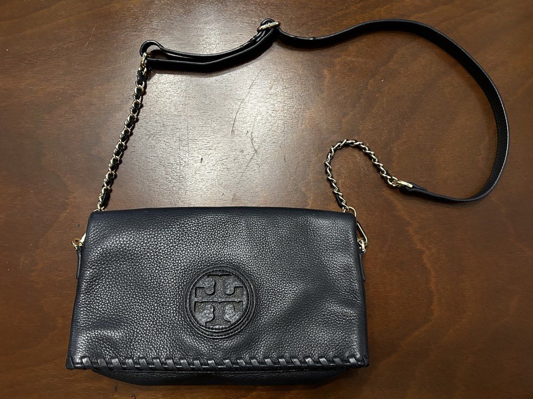 Tory Burch Black Leather Shoulder Bag with Chain Strap (Category: Luxury Bags & Wallets) located in Manila. Submitted by my_krophone (Listing ID 1455206737, Image 1). Description: - Genuine black pebbled leather Tory Burch shoulder bag - Elegant gold chain strap detail - Secure magnetic snap closure - Interior features a zippered pocket - Signature Tory Burch logo lining - Versatile for everyday wear or evening outings.
