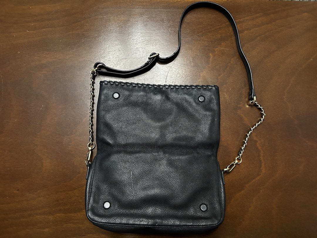 Tory Burch Black Leather Shoulder Bag with Chain Strap (Category: Luxury Bags & Wallets) located in Manila. Submitted by my_krophone (Listing ID 1455206737, Image 2). Description: - Genuine black pebbled leather Tory Burch shoulder bag - Elegant gold chain strap detail - Secure magnetic snap closure - Interior features a zippered pocket - Signature Tory Burch logo lining - Versatile for everyday wear or evening outings.