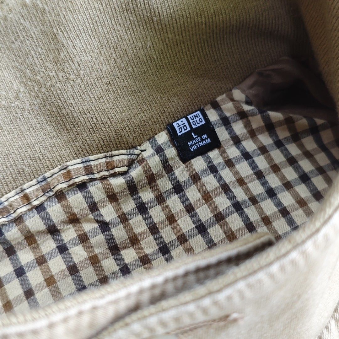 Uniqlo Harrington Jacket Khaki L (Category: Coats, Jackets and Outerwear) located in Tacloban City. Submitted by vraiethrft_55. (Listing ID 1455279899, Image 3). Description: - Classic beige Uniqlo jacket - Lined with brown and beige checkered pattern - Zip-up front with button collar closure - Ribbed cuffs and hem - Made in Vietnam - Perfect for casual wear.