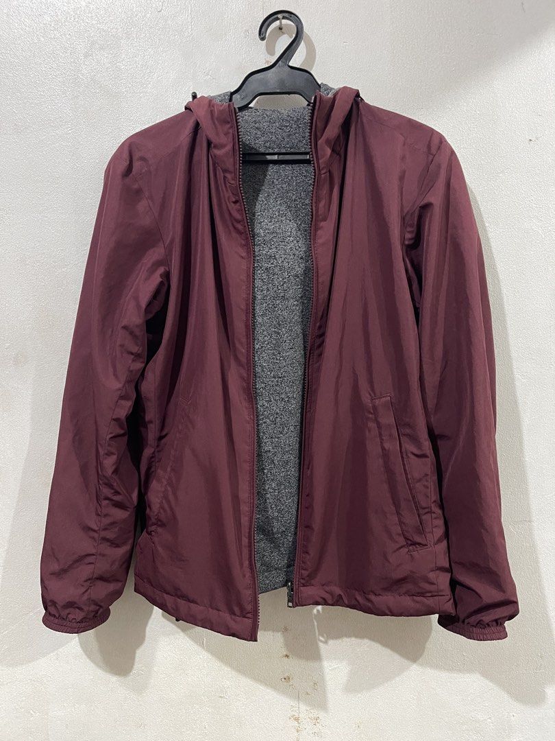Uniqlo Reversible Maroon Hoodie Jacket (Category: Coats, Jackets and Outerwear) located in Makati City. Submitted by vertaronda (Listing ID 1455147810, Image 1). Description: - 19” x 25” - Small - Reversible maroon jacket with grey fleece lining - Includes a hood - Zippered pockets for secure storage - Elastic cuffs and hem for a snug fit - Versatile for layering or as standalone outerwear.
