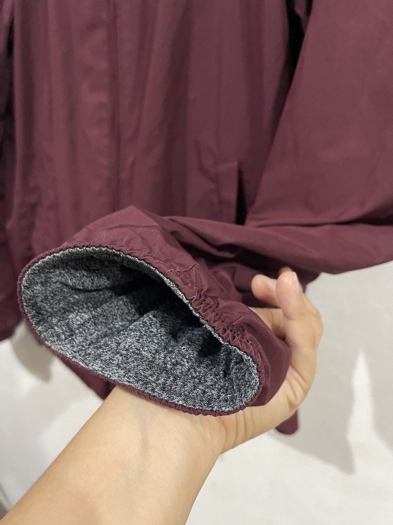 Uniqlo Reversible Maroon Hoodie Jacket (Category: Coats, Jackets and Outerwear) located in Makati City. Submitted by vertaronda (Listing ID 1455147810, Image 3). Description: - 19” x 25” - Small - Reversible maroon jacket with grey fleece lining - Includes a hood - Zippered pockets for secure storage - Elastic cuffs and hem for a snug fit - Versatile for layering or as standalone outerwear.