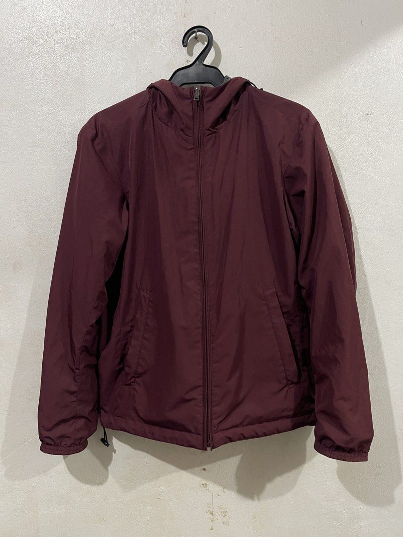 Uniqlo Reversible Maroon Hoodie Jacket (Category: Coats, Jackets and Outerwear) located in Makati City. Submitted by vertaronda (Listing ID 1455147810, Image 2). Description: - 19” x 25” - Small - Reversible maroon jacket with grey fleece lining - Includes a hood - Zippered pockets for secure storage - Elastic cuffs and hem for a snug fit - Versatile for layering or as standalone outerwear.
