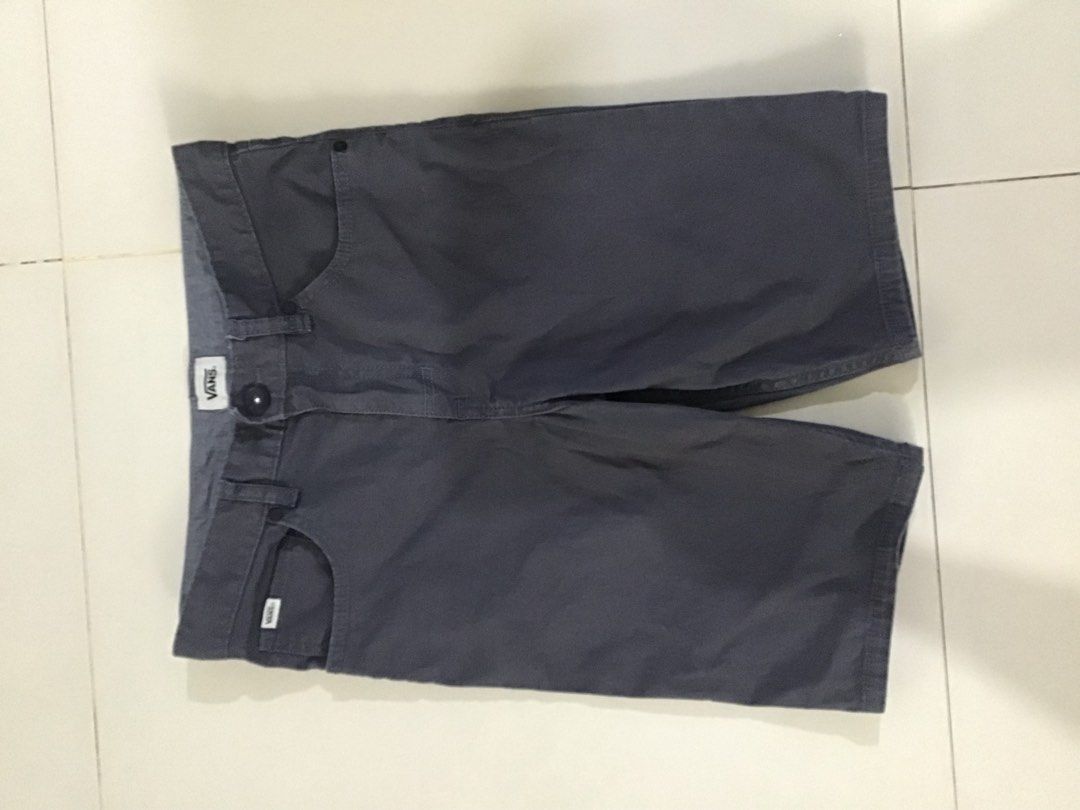 Vans Grey Chino Shorts Size 16 (Category: Shorts) located in Manila. Submitted by sandobag (Listing ID 1455204603, Image 1). Description: W 28 L 19 Excellent Condition Color rat:10/10 - Grey Vans chino shorts - Size 16 - Made in Bangladesh - Ideal for casual wear - Button and zip closure - Multiple pockets - Please check photos for detailed condition.