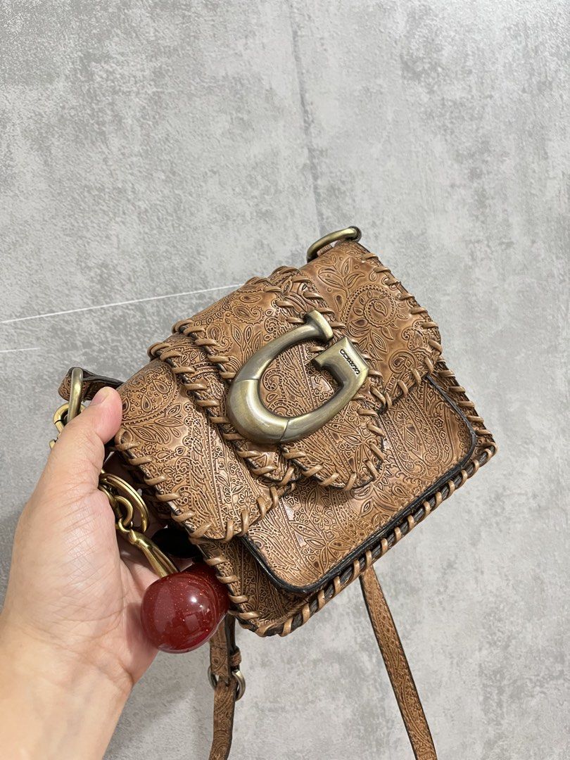 Vintage Coach Mini Guess Sling (Category: Luxury Bags & Wallets) located in Calamba. Submitted by thedreambags.ph (Listing ID 1455191524, Image 2). Description: No flaws Malinis and mabango.