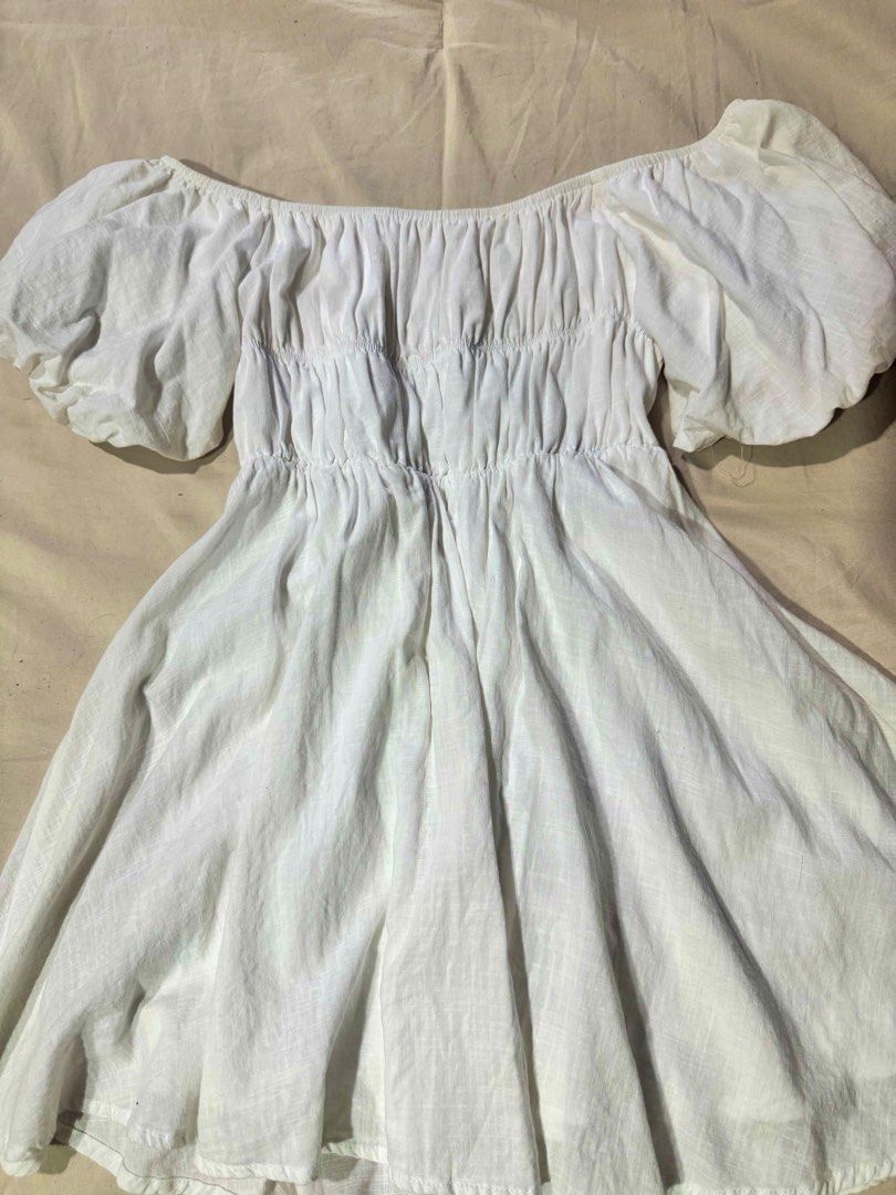 White Off-Shoulder Smocked Mini Dress (Category: Dresses) located in Quezon City. Submitted by chrollo7 (Listing ID 1455209296, Image 2). Description: - can fit xs-medium.