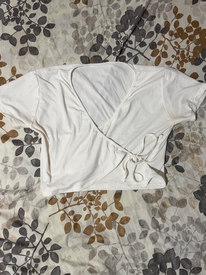 White Ribbed Wrap Crop Top with Tie (Category: Blouses) located in Taytay. Submitted by cloudy_20 (Listing ID 1455274330, Image 1). Description: - White ribbed wrap crop top - Short sleeves - Side tie closure - Very stretchy material - Perfect with high-waisted bottoms - Fits S-L.