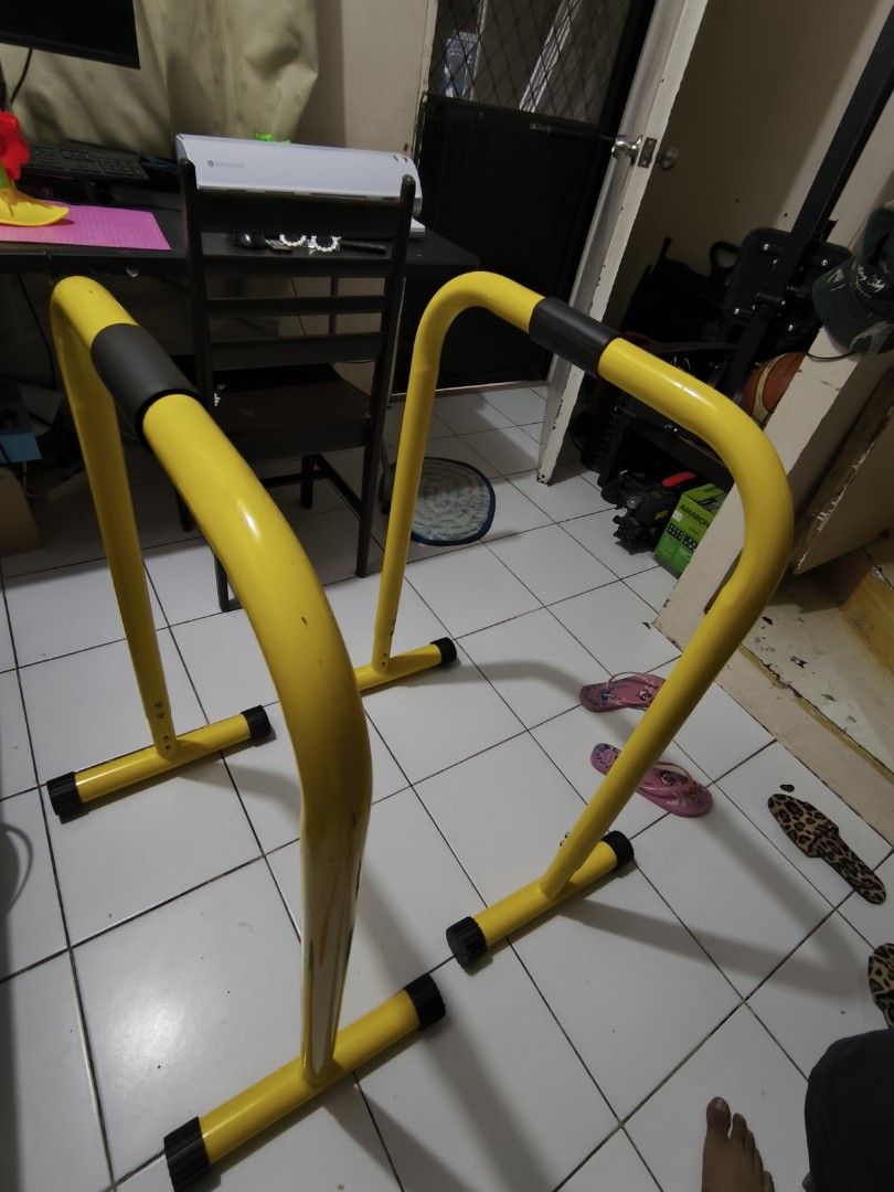 Yellow Parallel Bars for Home Gym Workout (Category: Weights & Dumbbells) located in Manila. Submitted by swiftbird_94ea39 (Listing ID 1455285781, Image 1). Description: Selling: Dip Bar Stands (2pcs) ✅ Heavy duty steel frame – matibay, kaya ang buong body weight ✅ Rubberized foot caps – hindi dumudulas at hindi nagmamarka sa floor ✅ Foam padded grip handles – comfortable sa kamay ✅ Adjustable height holes sa base (see 3rd photo) ✅ 2nd hand, func