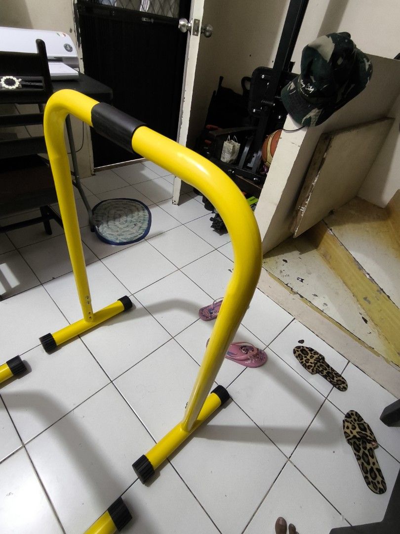 Yellow Parallel Bars for Home Gym Workout (Category: Weights & Dumbbells) located in Manila. Submitted by swiftbird_94ea39 (Listing ID 1455285781, Image 3). Description: Selling: Dip Bar Stands (2pcs) ✅ Heavy duty steel frame – matibay, kaya ang buong body weight ✅ Rubberized foot caps – hindi dumudulas at hindi nagmamarka sa floor ✅ Foam padded grip handles – comfortable sa kamay ✅ Adjustable height holes sa base (see 3rd photo) ✅ 2nd hand, func